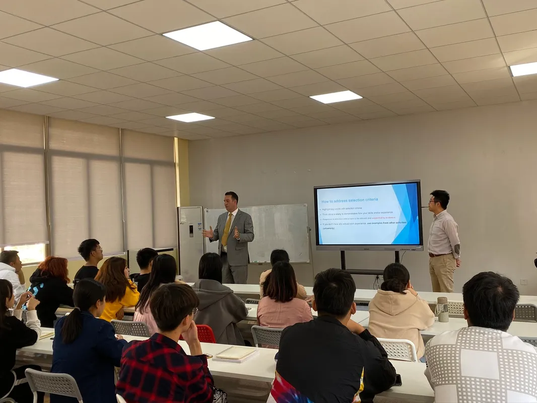 Heath teaching a classroom of students at Huashang College