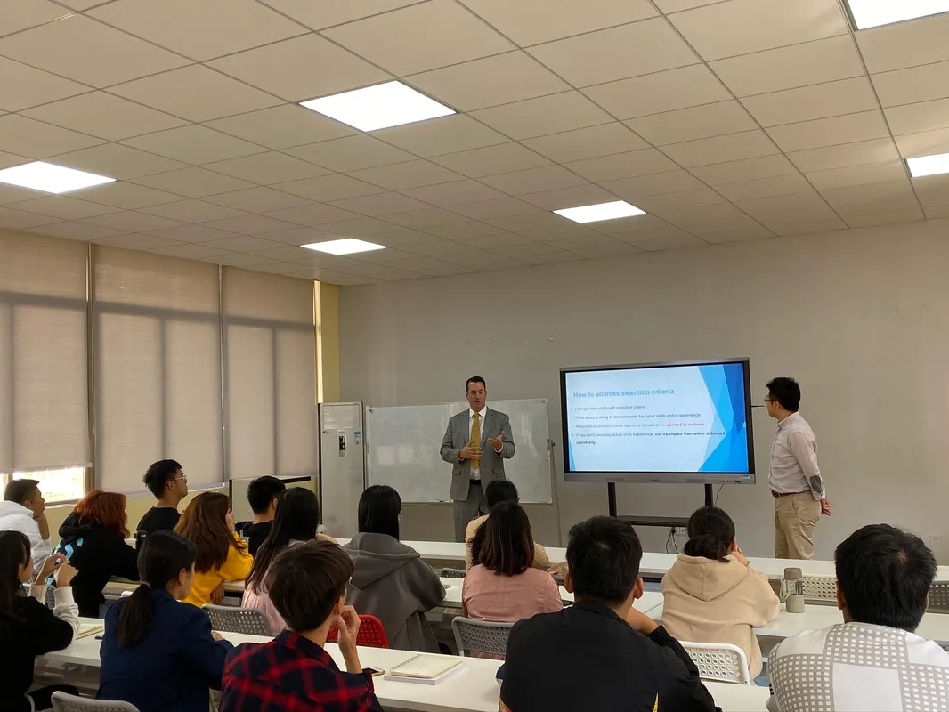 Heath lecturing a full room at Huashang College, Guangzhou